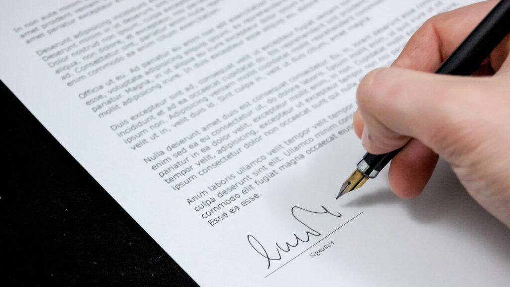 A person signing a contract